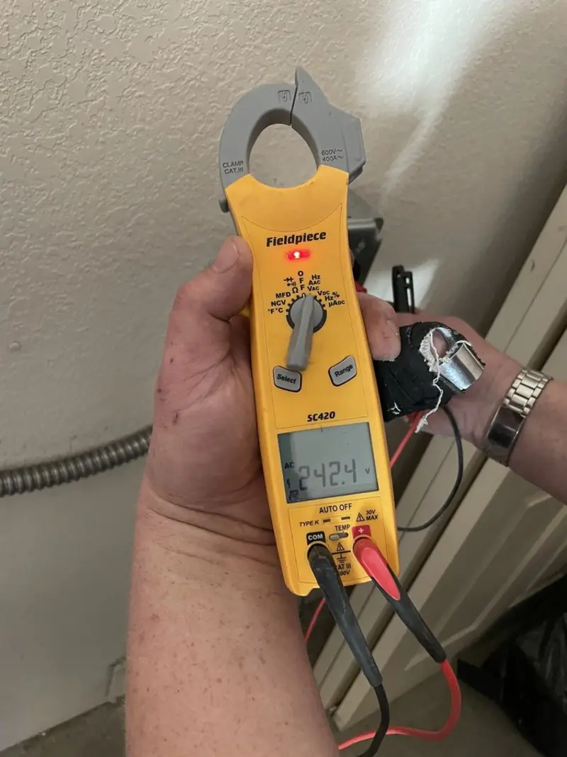Voltage testing with clamp meter during Ceiling Fan Installation in Attalla